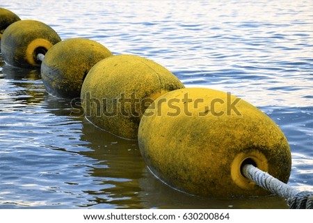 Buoy in the sea Royalty-Free Stock Photo #630200864