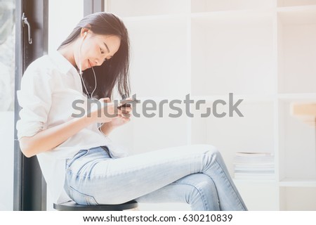 young beautiful woman listen music