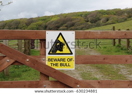 Beware of the Bull sign on the farm gate
