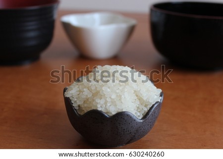 japan of rice in cup on table and blurred background