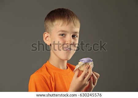 Boy eating a cupcake