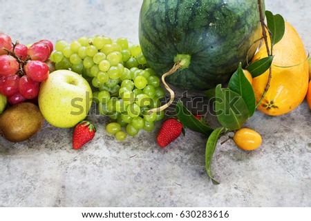 Assortment Tropical Fruits and Berry Raw Eating Diet Concept Food on Grey Background High Resolution Top View
