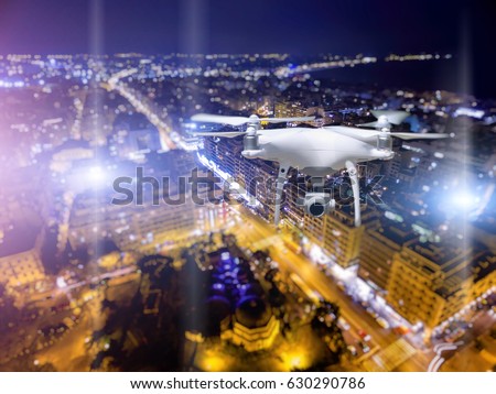 Drone flying over Thessaloniki city on blurred background. 