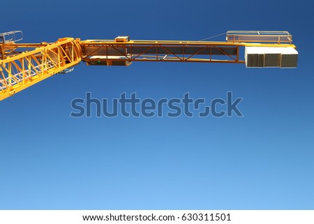 Yellow colored Crane with blue sky