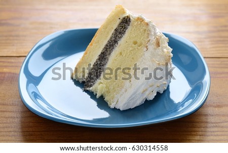 Lemon poppy seed sponge cake with curd cream and meringue