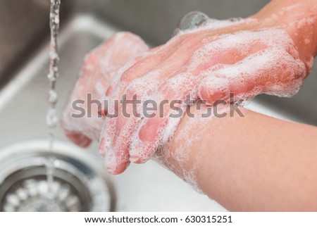 Hygiene. Cleaning Hands. Washing hands with soap Royalty-Free Stock Photo #630315251