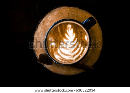 Latte tree art on wooden table
