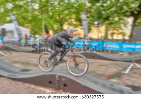 Picture blurred for background abstract and can be illustration Blurred background of Cyclist during the competition
