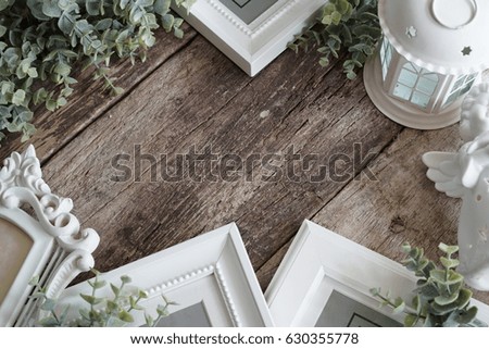 Flat lay image of white picture frames and home decoration for Christmas composition with the copy space