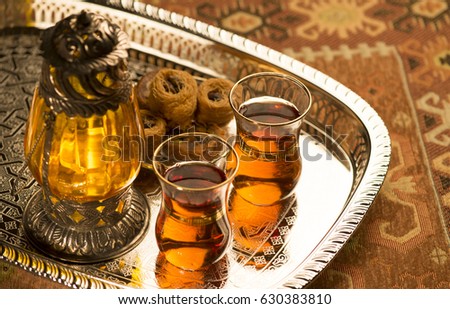 Arabic lantern, baklava sweet and tea. Still life.