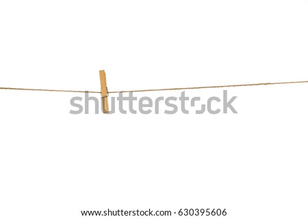 Wooden Clothespins with the rope on a white background Royalty-Free Stock Photo #630395606