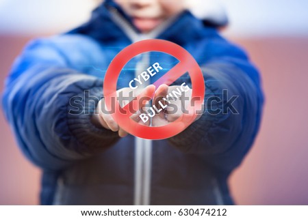 Child pressing cyberbullying stop symbol on virtual touch screen. Cyberbullying awareness.