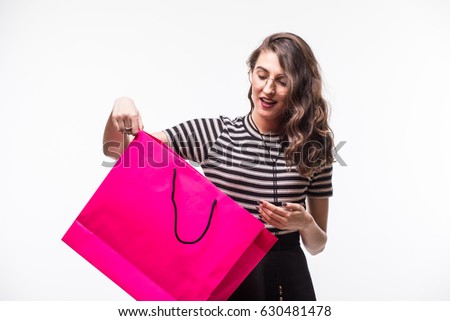 portrait of beautiful happy sweet surprised woman girl holding in her hands big shopping bag isolated on white