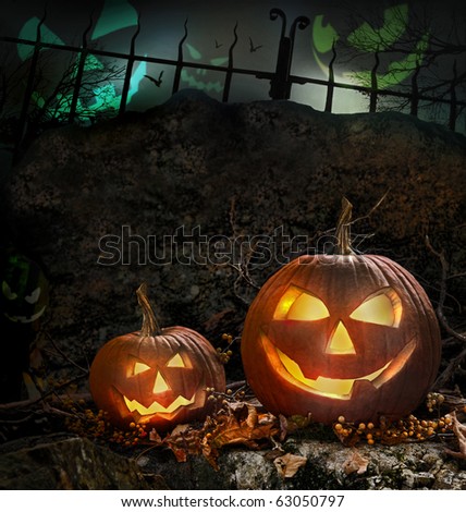 Halloween pumpkins on rocks in a forest at night
