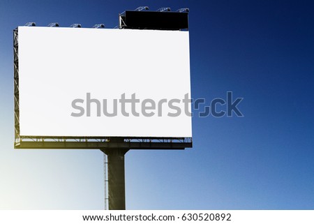 Blank billboard against blue sky background