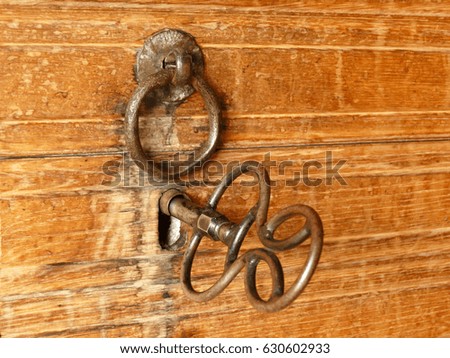 Old key to the wooden door