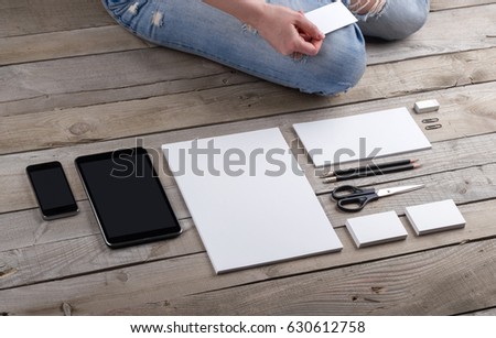 Photo of branding identity mock up with a person. Template isolated on old wood background with girl. For graphic designers presentations and portfolios damaged weathered antique mock-up with man