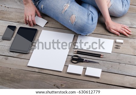 Photo of branding identity mock up with a person. Template isolated on old wood background with girl. For graphic designers presentations and portfolios damaged weathered antique mock-up with man