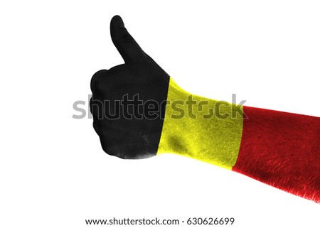 Hand making thumbs up sign. Belgium painted with flag as symbol of thumbs like,up,okay. Isolated on white background.