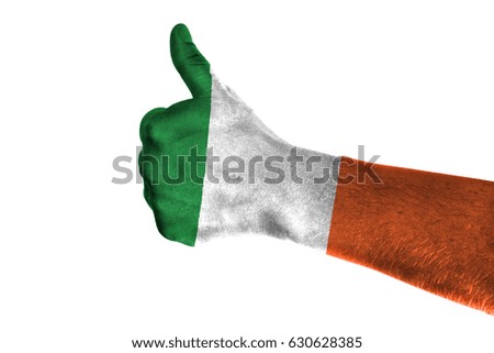 Hand making thumbs up sign. Irelan painted with flag as symbol of thumbs like,up,okay. Isolated on white background.