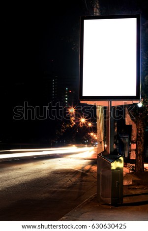 Blank advertising billboard in the city at night.