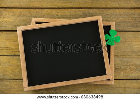 St Patricks Day shamrock on the slate on wooden table