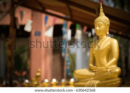 Old Buddha statue in Buddhist  temple or Wat, the public domain or treasure of Buddhism. (Shot at outdoor ,public area)