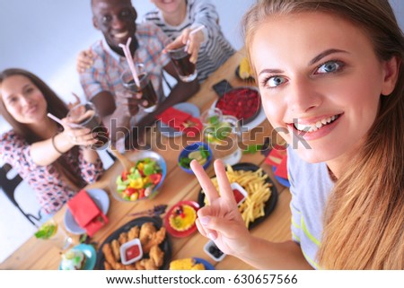Group of people doing selfie during lunch