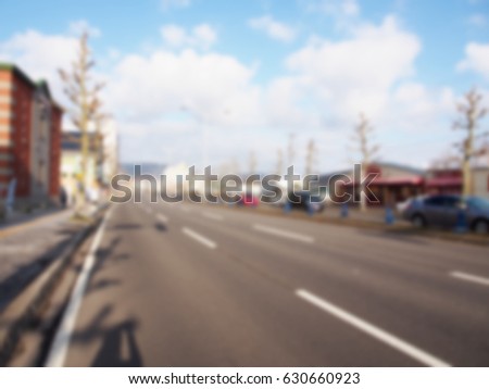 Blurred city street background.