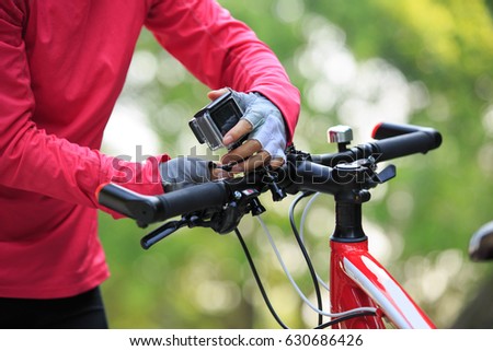 cyclist put the action camera on mountain bike