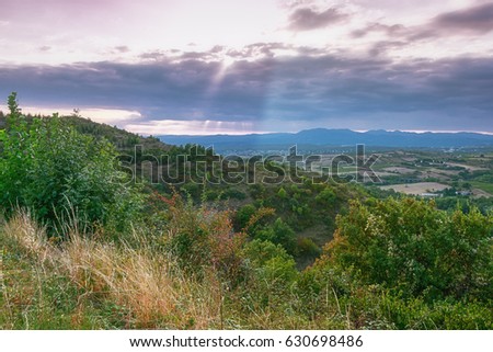 Panorama of a valley in the Ardeche with in the background the mountains of the Ardeche in France