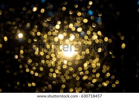 drops on glass and evening lights