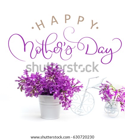 lilac flowers on a white background decorated with small bike and text Happy mothers day. Calligraphy lettering hand draw