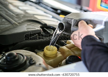 Automobile maintenance / engine oil, coolant exchange Royalty-Free Stock Photo #630720755