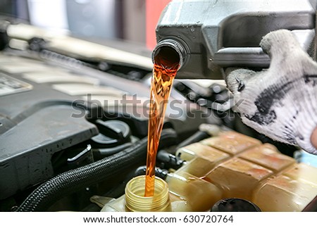Automobile maintenance / engine oil, coolant exchange Royalty-Free Stock Photo #630720764