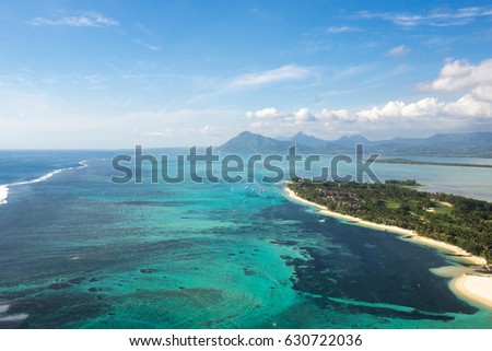 Aerial view of the island of Benitier and the village of La Galette. Mauritius. Picture taken from helicopter