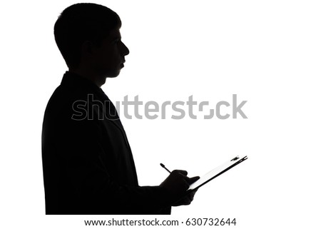 Silhouette of a young business man in a shirt and pants signing a loan agreement, work contract, purchase, credit on a white isolated background