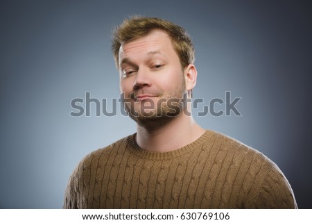 Arrogant bold self important stuck up man with napoleon complex Royalty-Free Stock Photo #630769106