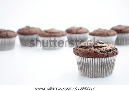 Chocolate muffins on white background. Picture for a menu or a confectionery catalog.