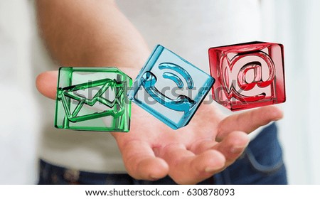 Businessman on blurred background holding transparent cube contact icon in his hand 3D rendering