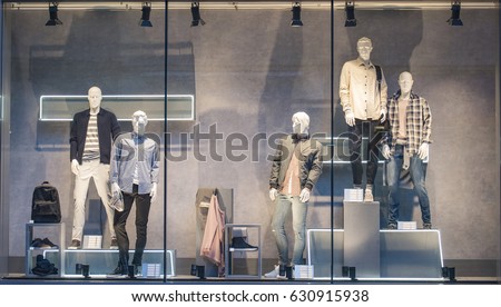 Men clothing in a showcase in London. Royalty-Free Stock Photo #630915938