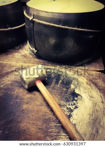 Parma, Italy, cheese making tools, hammer for cheese Royalty-Free Stock Photo #630931397