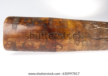 African music instrument, trumpet with African symbols, handmade, isolated on white background