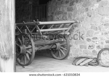 black and white photo of an old farm utility wagon