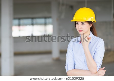 Portrait asian woman engineer standing at construction workplace