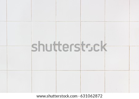 white tiles wall in the office White tiled wall for bedroom, kitchen, bathroom and interior design. White tiled wall in clean and symmetrical textured background view with grid texture background.