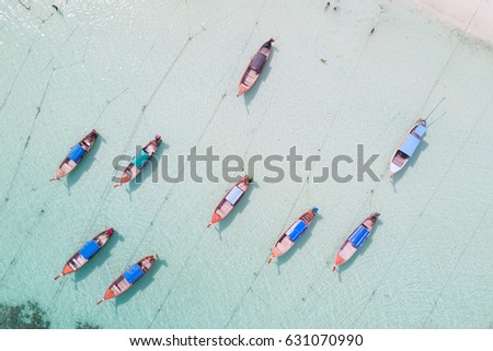 Aerial view over group of long tail boats,Top view from drone, Koh Lipe island, Satun,Thailand.