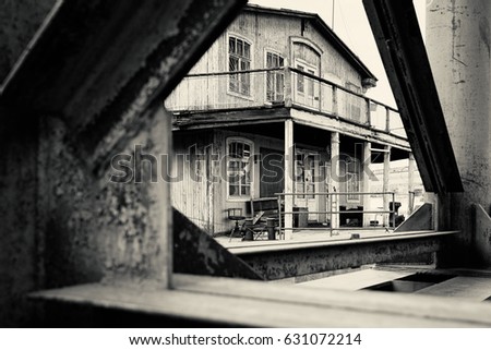 Old abandoned house on the pier in retro film look picture style