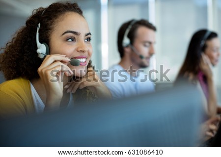 Customer service executive working at office Royalty-Free Stock Photo #631086410