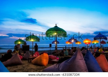 Enjoy sunset at Seminyak (Kuta) Bali - Indonesia Royalty-Free Stock Photo #631087334